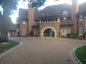 Resin bound driveway in front of a large brick house