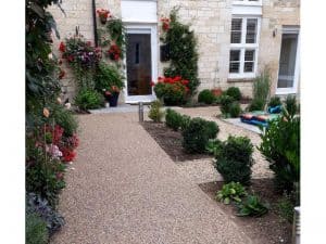 Resin bound pathway with flower borders at a mews in Winchcombe