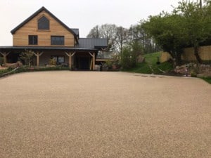 Resin bound drive in front of a timber-clad house near Newent