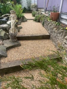 Stepped resin bound garden path with timber risers