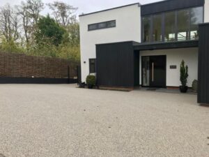 Resin bound driveway at a modern black and white house