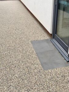 Resin bound path meeting a patio door threshold