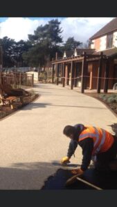 StyleSeal installer trowelling a resin bound path