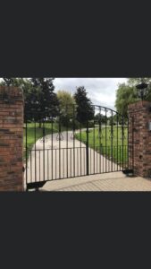 Resin bound driveway through an iron gateway