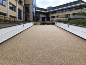 Resin bound walkway between modern apartment buildings