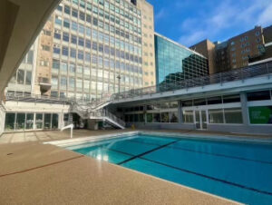 Resin bound deck around an outdoor pool at an apartment complex
